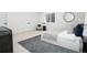 Modern bedroom with neutral colors, a large bed, and ample natural light creating a serene and inviting atmosphere at 44 N Big Meadow Trl, Franktown, CO 80116