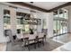 Elegant dining room with stylish lighting and scenic views at 44 N Big Meadow Trl, Franktown, CO 80116