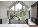 Bright foyer area with large windows offering views of nature at 44 N Big Meadow Trl, Franktown, CO 80116