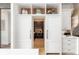 Well-organized kitchen with sleek appliances, custom cabinets, and ample storage space at 44 N Big Meadow Trl, Franktown, CO 80116