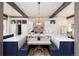 Gourmet kitchen with custom cabinetry, breakfast nook, and high-end appliances at 44 N Big Meadow Trl, Franktown, CO 80116