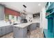 Well-appointed laundry room with custom cabinetry and plenty of countertop space at 44 N Big Meadow Trl, Franktown, CO 80116
