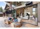 Inviting living area with stone fireplace, comfortable seating, and seamless indoor-outdoor flow at 44 N Big Meadow Trl, Franktown, CO 80116