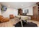 Charming home office with built-in shelves, wood floors, a modern desk, and ample natural light for productivity at 44 N Big Meadow Trl, Franktown, CO 80116