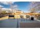 Spacious backyard deck features a grill, outdoor seating and a fenced yard, ideal for entertaining at 4927 Tarcoola Ln, Highlands Ranch, CO 80130