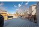 View of the backyard deck, complete with outdoor seating and a grill for outdoor dining and entertaining at 4927 Tarcoola Ln, Highlands Ranch, CO 80130