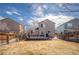 Backyard featuring a deck with a grill and patio furniture, surrounded by a wood fence at 4927 Tarcoola Ln, Highlands Ranch, CO 80130