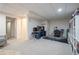 Finished basement featuring a carpeted floor, a drop ceiling, and two desk areas for working at 4927 Tarcoola Ln, Highlands Ranch, CO 80130