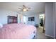 A spacious main bedroom with a ceiling fan and a walk-in closet, creating a tranquil retreat at 4927 Tarcoola Ln, Highlands Ranch, CO 80130