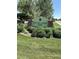 Big Dry Creek Park sign with lush greenery, surrounded by mature trees in a peaceful neighborhood at 4927 Tarcoola Ln, Highlands Ranch, CO 80130