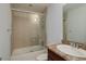 Bathroom features a shower with glass doors, tile walls, vanity and neutral finishes at 6821 W Yale Ave, Lakewood, CO 80227
