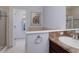 Bathroom features tile and glass shower doors, vanity and neutral finishes at 6821 W Yale Ave, Lakewood, CO 80227