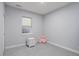Bedroom features a plush rug, neutral walls, white trim and accent furniture at 6821 W Yale Ave, Lakewood, CO 80227