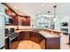 Well-equipped kitchen with stainless steel appliances and an open layout to the living area at 6821 W Yale Ave, Lakewood, CO 80227