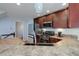 Functional kitchen with granite countertops, stainless steel appliances, and ample cabinet space at 6821 W Yale Ave, Lakewood, CO 80227