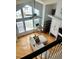 Bright and airy living room with vaulted ceilings and large windows, as seen from the upper level at 6821 W Yale Ave, Lakewood, CO 80227