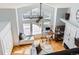 Bright living room featuring high ceilings, large windows, and modern furnishings at 6821 W Yale Ave, Lakewood, CO 80227