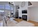 Spacious living room featuring a fireplace, large windows, and an open layout perfect for entertaining at 6821 W Yale Ave, Lakewood, CO 80227