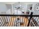 Upper floor view of a bright living room featuring high ceilings, large windows, and modern furnishings at 6821 W Yale Ave, Lakewood, CO 80227
