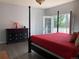Well-lit main bedroom with access to the outdoor balcony and a view of the surroundings at 6821 W Yale Ave, Lakewood, CO 80227