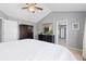 Bright main bedroom with vaulted ceiling, neutral walls, closet and ensuite bathroom at 10903 Parker Vista Way, Parker, CO 80138