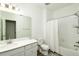 Well-lit bathroom with a single vanity, toilet, and shower/tub combination at 8376 Lorenzo Ln # A, Highlands Ranch, CO 80129