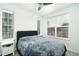 Bright bedroom with a comfortable bed and large windows bringing in natural light at 8376 Lorenzo Ln # A, Highlands Ranch, CO 80129