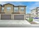 Spacious townhome featuring attached garages, and neutral exterior paint scheme at 8376 Lorenzo Ln # A, Highlands Ranch, CO 80129