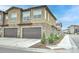 Modern townhomes featuring garages, and low-maintenance landscaping at 8376 Lorenzo Ln # A, Highlands Ranch, CO 80129