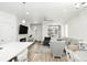 Open-concept living room with modern furnishings, a fireplace, and great natural lighting at 8376 Lorenzo Ln # A, Highlands Ranch, CO 80129