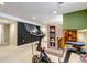 Finished basement with exercise equipment and unique architectural features at 1250 S Vine St, Denver, CO 80210