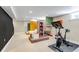 Finished basement featuring a modern exercise area with a built-in entertainment center and unique design elements at 1250 S Vine St, Denver, CO 80210