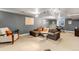 Finished basement offering a seating area, track lighting, and a drum kit for entertainment at 1250 S Vine St, Denver, CO 80210