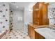 Elegant bathroom featuring a walk-in shower, classic vanity, and sophisticated marble accents at 1250 S Vine St, Denver, CO 80210