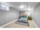 This cozy bedroom features a window, striped bedding, neutral walls, and colorful bedside accents at 1250 S Vine St, Denver, CO 80210