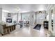 Open living space with a fireplace, stylish decor, and an entryway with a decorative door at 1250 S Vine St, Denver, CO 80210