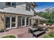 Outdoor patio featuring a dining set with an umbrella, with exterior home architectural detail at 1250 S Vine St, Denver, CO 80210