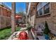 Cozy brick patio featuring comfortable seating, colorful cushions, and a charming outdoor space for relaxation at 1250 S Vine St, Denver, CO 80210