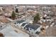 Aerial view of three new construction homes in a residential neighborhood at 3224 W Dakota Ave, Denver, CO 80219