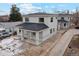Two story house, gray siding, dark roof, small front porch, and driveway at 3224 W Dakota Ave, Denver, CO 80219