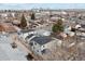 Aerial view of three new houses in a neighborhood near Denver skyline at 3224 W Dakota Ave, Denver, CO 80219
