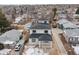 Newly constructed homes with gray siding and dark roofs, viewed from above at 3224 W Dakota Ave, Denver, CO 80219