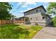 A spacious backyard with well-maintained lawn and a patio, excellent for outdoor activities at 3224 W Dakota Ave, Denver, CO 80219