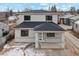 Two-story house with gray siding, dark roof, and small front porch at 3224 W Dakota Ave, Denver, CO 80219