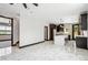 Spacious living room with recessed lighting, marble floors, open floor plan and modern black trim at 3224 W Dakota Ave, Denver, CO 80219