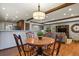 Dining area with hardwood floors next to kitchen and living room at 9161 W Hialeah Pl, Littleton, CO 80123