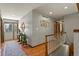 Entryway featuring hardwood floors, stairway, and recessed lighting at 9161 W Hialeah Pl, Littleton, CO 80123