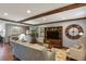 Spacious living room featuring hardwood floors, recessed lighting, and built in shelving at 9161 W Hialeah Pl, Littleton, CO 80123