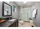 Sleek bathroom featuring a glass shower, contemporary fixtures, and a modern vanity sink at 930 Acoma St # 106, Denver, CO 80204
