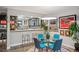 Stylish dining area adjacent to the kitchen, featuring unique decor and a modern light fixture at 930 Acoma St # 106, Denver, CO 80204